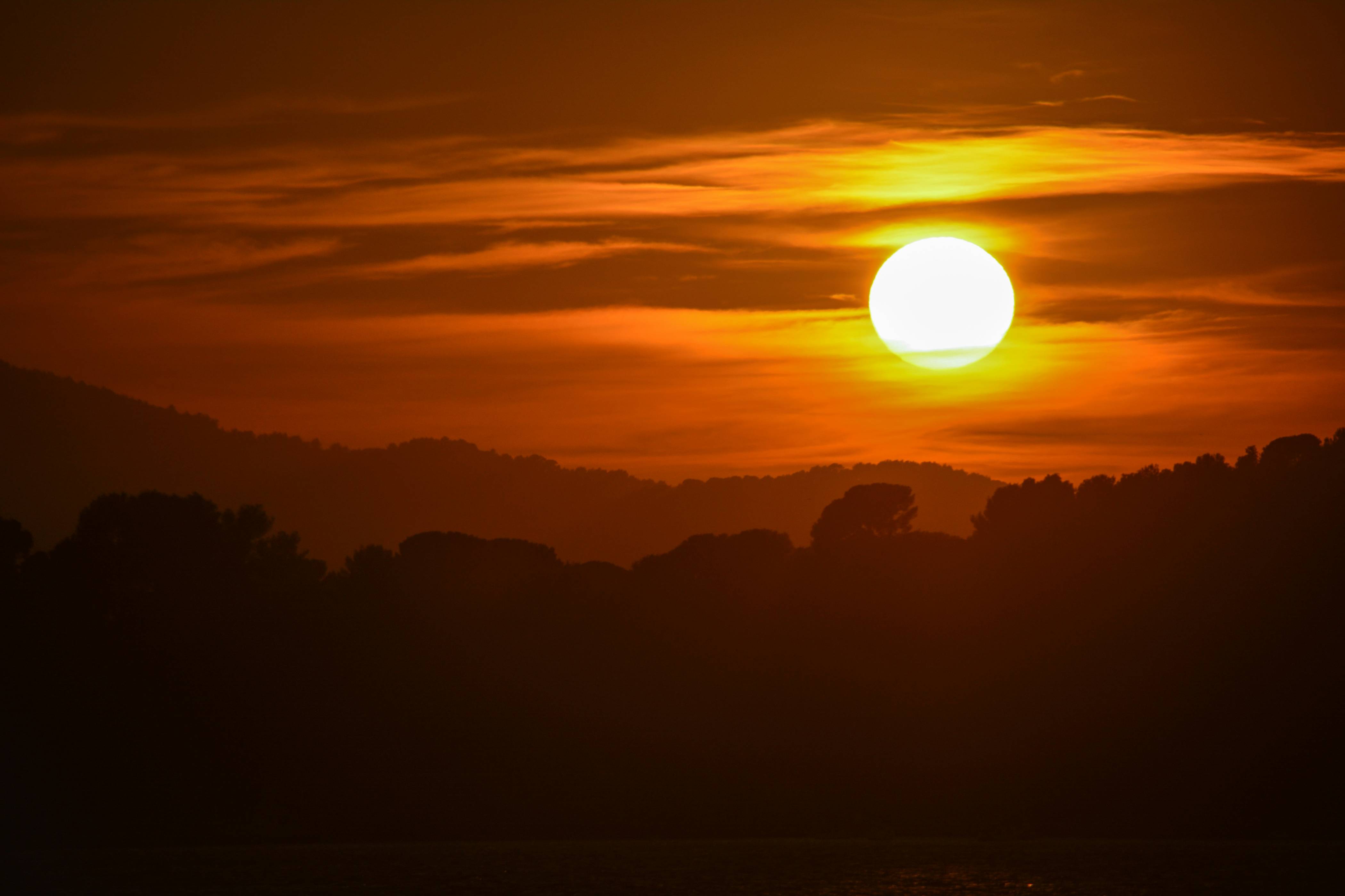 silhouette of mountain during sunset