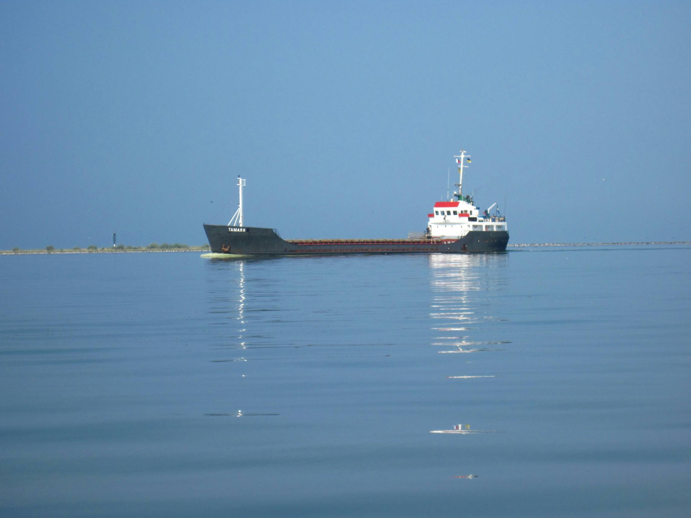 a large boat floating on top of a large body of water